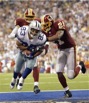 capt.1cc6dd2d73ef4e32952a55a379ef56bd.redskins_cowboys_football_irv117